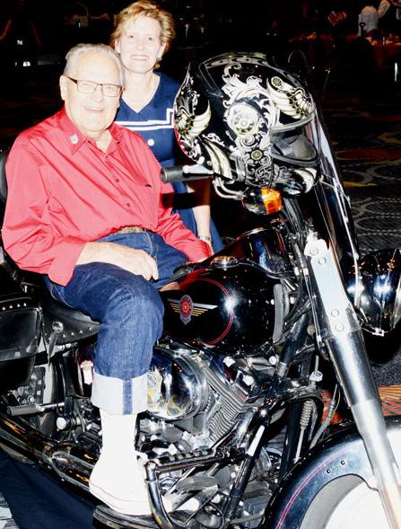 PDG Matt Matson tries out PDG Kelly Atkinson s Harley- Davidson