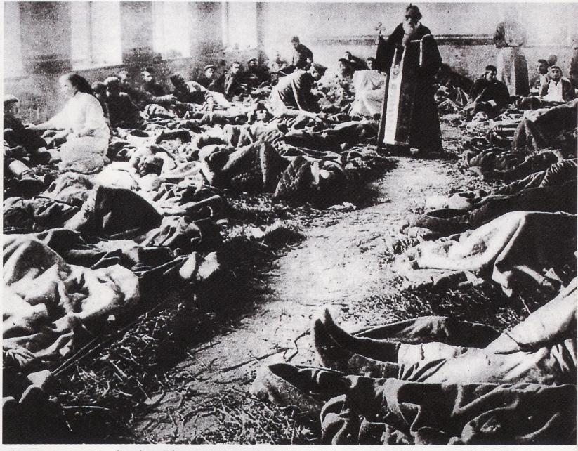 Source A (A photograph of a priest blessing wounded Russian Troops in