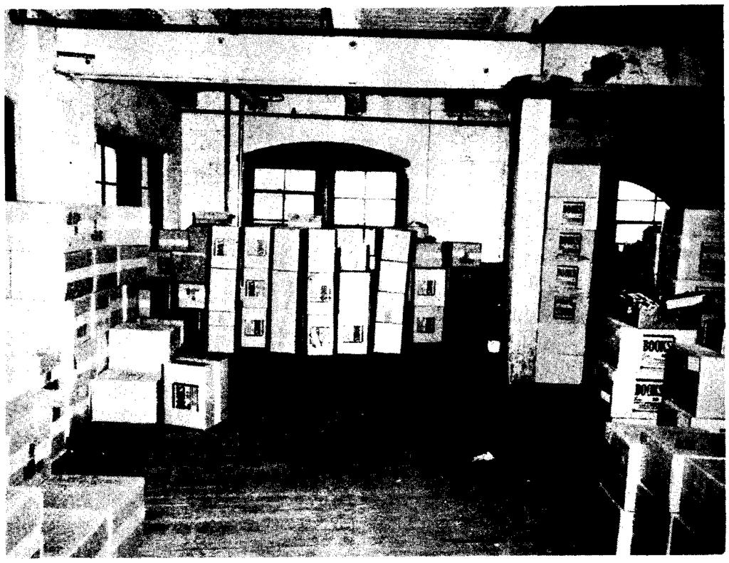The Alibi: Oswald's Actions after the Shots 211 boxes were situated behind the first stacks; these formed a wall that had no openings large enough for a man to penetrate without contortion.