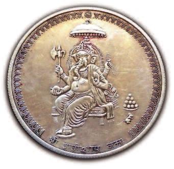 Today tokens Figure 9 Silver token of Ganesha. Notice the mouse in the lower right field. Diameter 39 mms.