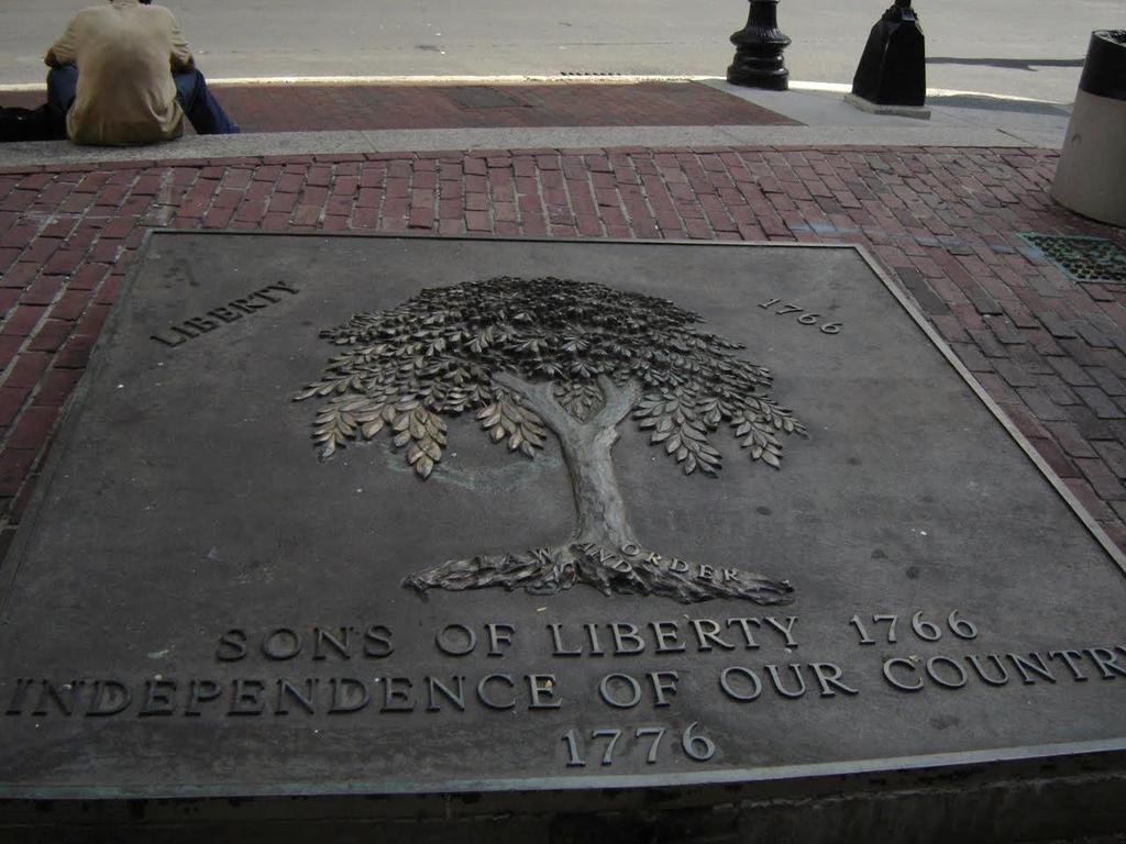 The other is like a bronze tombstone planted in the sidewalk. The men who met under the first Liberty Tree called themselves the Sons of Liberty.