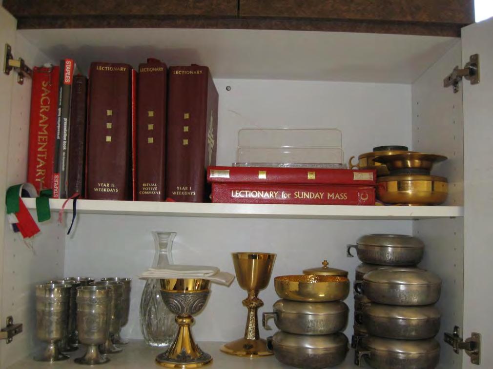 Liturgical Vessels in Cabinet Above Sink Flagon Book of Gospels Stand