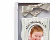 Christmas Story Window Ornaments Materials: resin and metal Treatments: metallic gray frame with red enamel border, etched metal insert Features: red ribbon to hang Size: 2 1/4 x 5 1/4 Packaging: