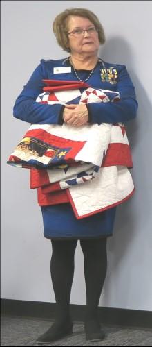 Laura presented quilts to eight OMC veterans for their military  Left: personalized inscription on quilts with