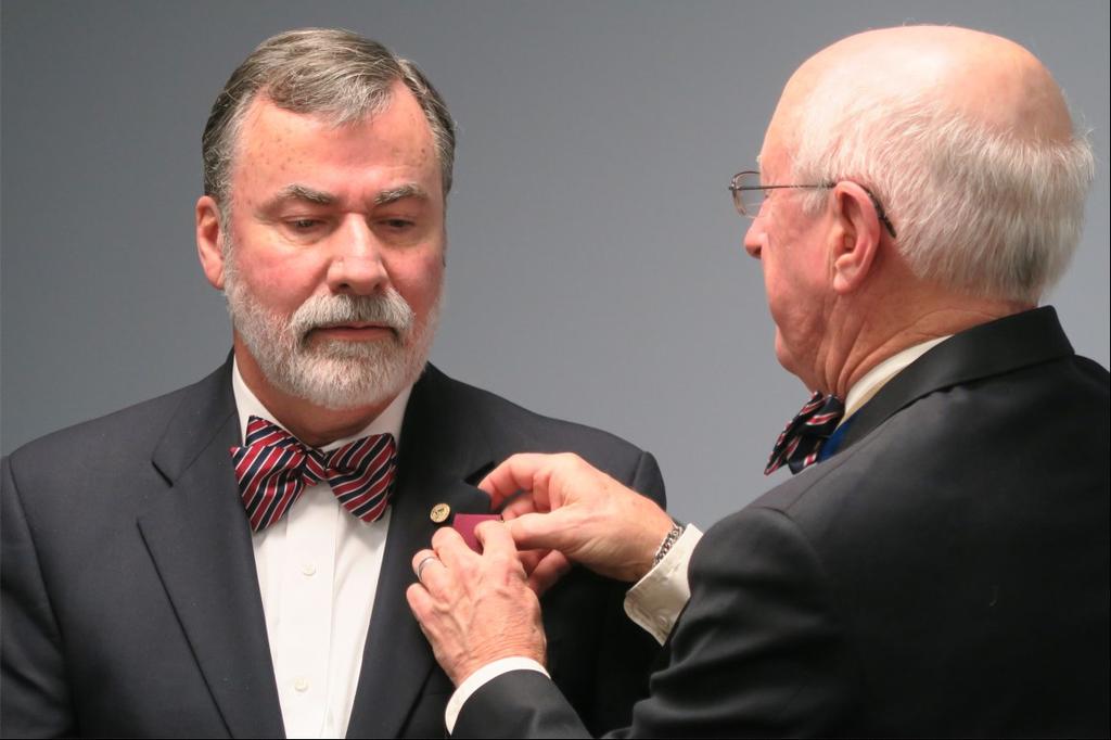 President Dan Philbrick (right) presented the Chapter Distinguished Service Medal