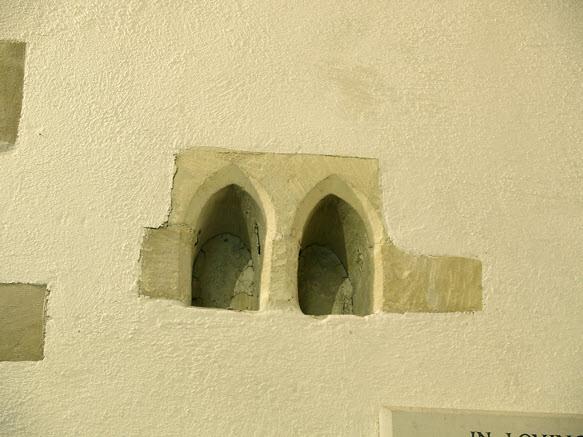 ...The two arched alcoves, left, on the north wall which might have contained bells, relics or, it has been suggested, the hearts of people revered or prayed