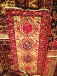 PERSONAL STORIES The Gift of a Carpet The final carpet is not Iranian. It was made somewhere quite recently in the Caucasus. It is flat woven, its colours are vivid, and its motifs simple and lively.