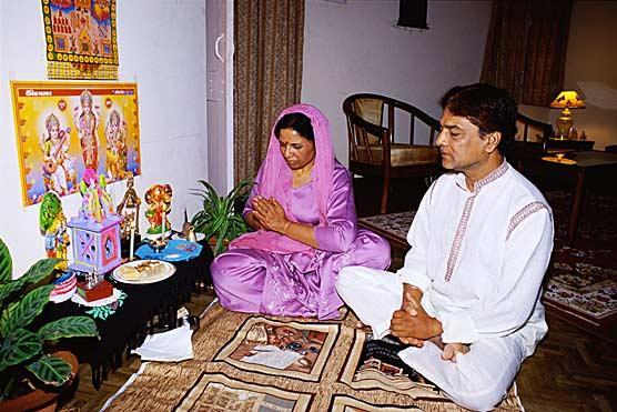 Hindu Family Praying at Home Many Hindus worship a deity that they have personally chosen.