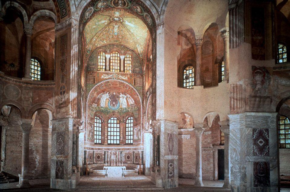 Interior of the church was adorned with rich book matched marbles, and golden colorful mosaics depicting justinian as the central ruler.
