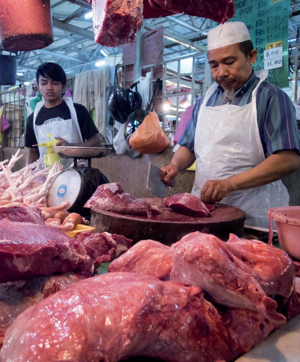 Men selling halal meat at their stall in Chow