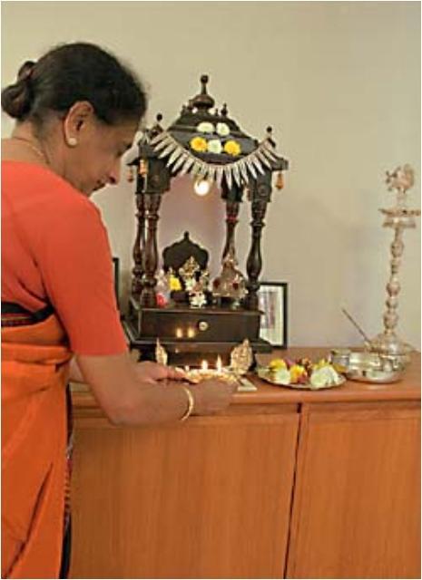 Hindu Practices Items at the home altar include water, a bell, a lamp, an incense burner,