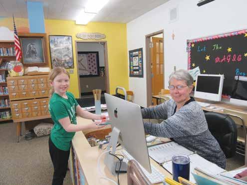 Sharing a Love of Lea Our Lady of the Angels parishioner Kathi Primus has been volunteering at the Holy Family School library for nearly 30 years.