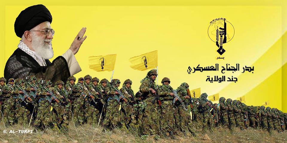 Figure 9: Iran s Supreme Leader waves and smiles as Badr Organization militiamen stand below him.