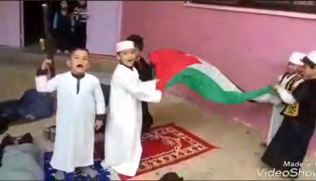 victory by waving Palestinian