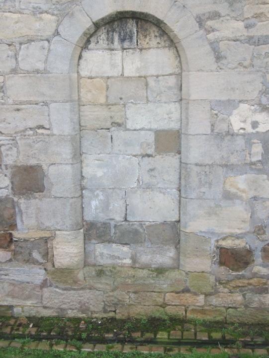 Pevsner concludes that the aisles embrace the tower and that they were first built during 13 th Century, and you can tell this through the West lancet, the North doorway (now bricked up) and the