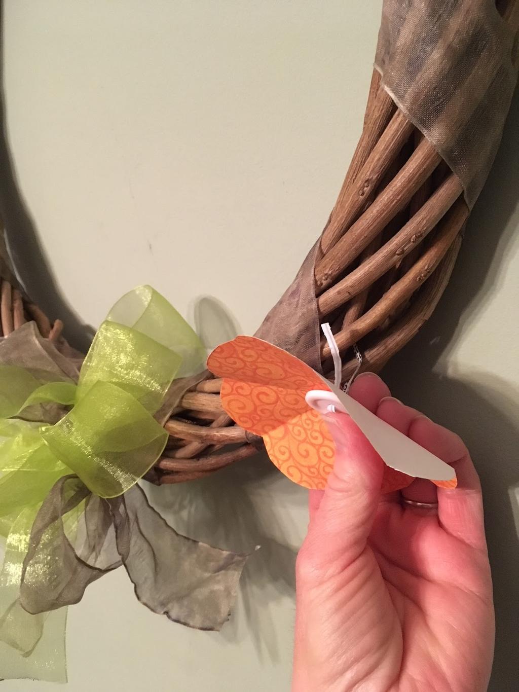Use the twist tie to attach the ower to the wreath. It is up to your family whether you make one ower each day, or make all 49 at the beginning of Lent and just add one to the wreath each day.