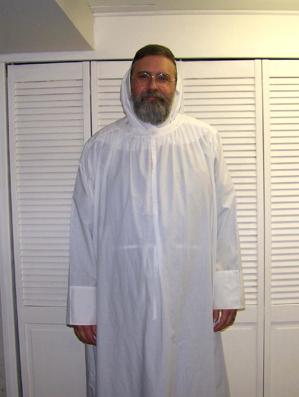 He next puts on e alb, from e Latin alba - as it is a white vestment or robe symbolizing purity. The alb evolved from e old Roman under-tunic and has always been worn by e church s ministers.