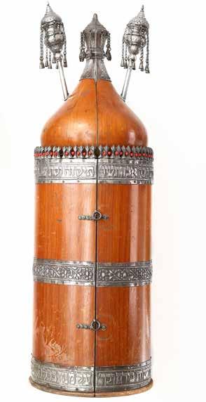 83 Torah Scroll with Case and Finials. Iraq. 20th Century Torah Scroll on gevil, within a magnificent wood case integrated with silver strips and with original silver finials. Iraq. End of the 1940s.