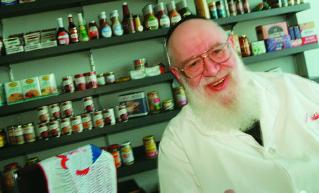 232 EXPLORING WORLD RELIGIONS Figure 6.14 Rabbi Harry Newmark, a full-time kosher food checker, monitors the food-manufacturing process.