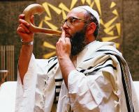 234 EXPLORING WORLD RELIGIONS Figure 6.17 One of the most important observances of Rosh Hashanah is the sounding of the shofar in the synagogue.