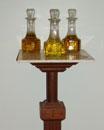 HOLY OILS The pedestal contains the Oil of the Infirm, the Oil of