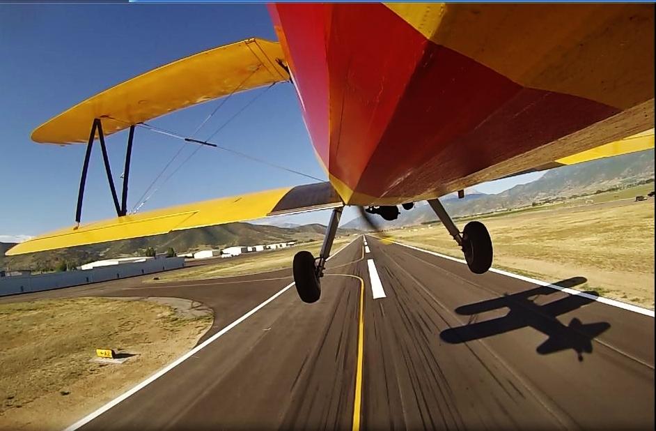 Photo of the Month GoPro snapshot taken of our Stearman on July 18 th, 2015 as it lifted off for Logan-Cache Airport.