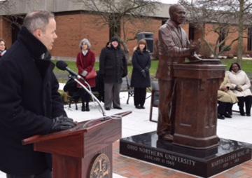 Artist Tad McKillop speaks at the unveiling of his 700-pond bronze sculpture of Dr. Martin Luther King, Jr. at Ohio Northern on Tuesday morning. He said he tried to make the sculpture represent Dr.