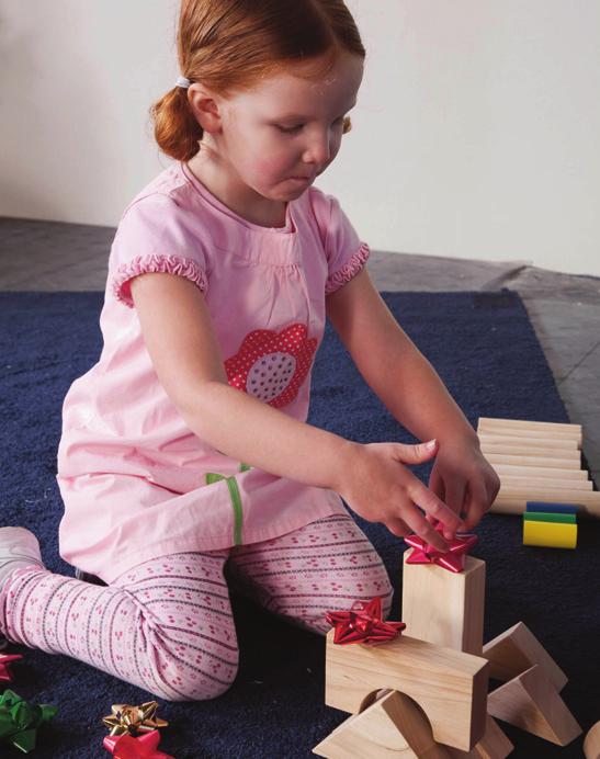 Play to Learn Bible Verse Activities Blocks Center Bible, blocks, a variety of Christmas decorations (garland, unbreakable ornaments, etc.), self-stick gift bows.