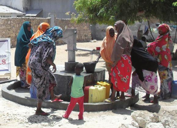 SADAQA JARIYAH SOMALIA Continued Support for the People of Somalia: Two New Water Wells Built in Mogadishu Somalia Beneficiaries happily getting fresh, clean water from a well built by ZF.