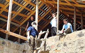 Armenia working on a half-built house for the Haroyan family