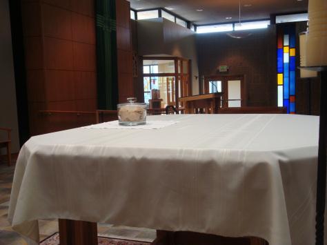 Put the chalice and large bread plate on the credence table, and the Roman Missal in the priest s chair. Then go back to your seats, sit down, and join in singing the communion songs.