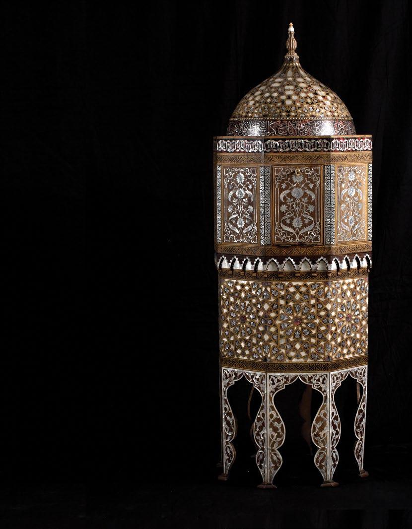 The octagonal shaped middle section with a band of inlaid tortoiseshell and mother-of-pearl interlacing floral motifs surrounding the top Mother-of-pearl inlaid interlacing foliage and arabesque