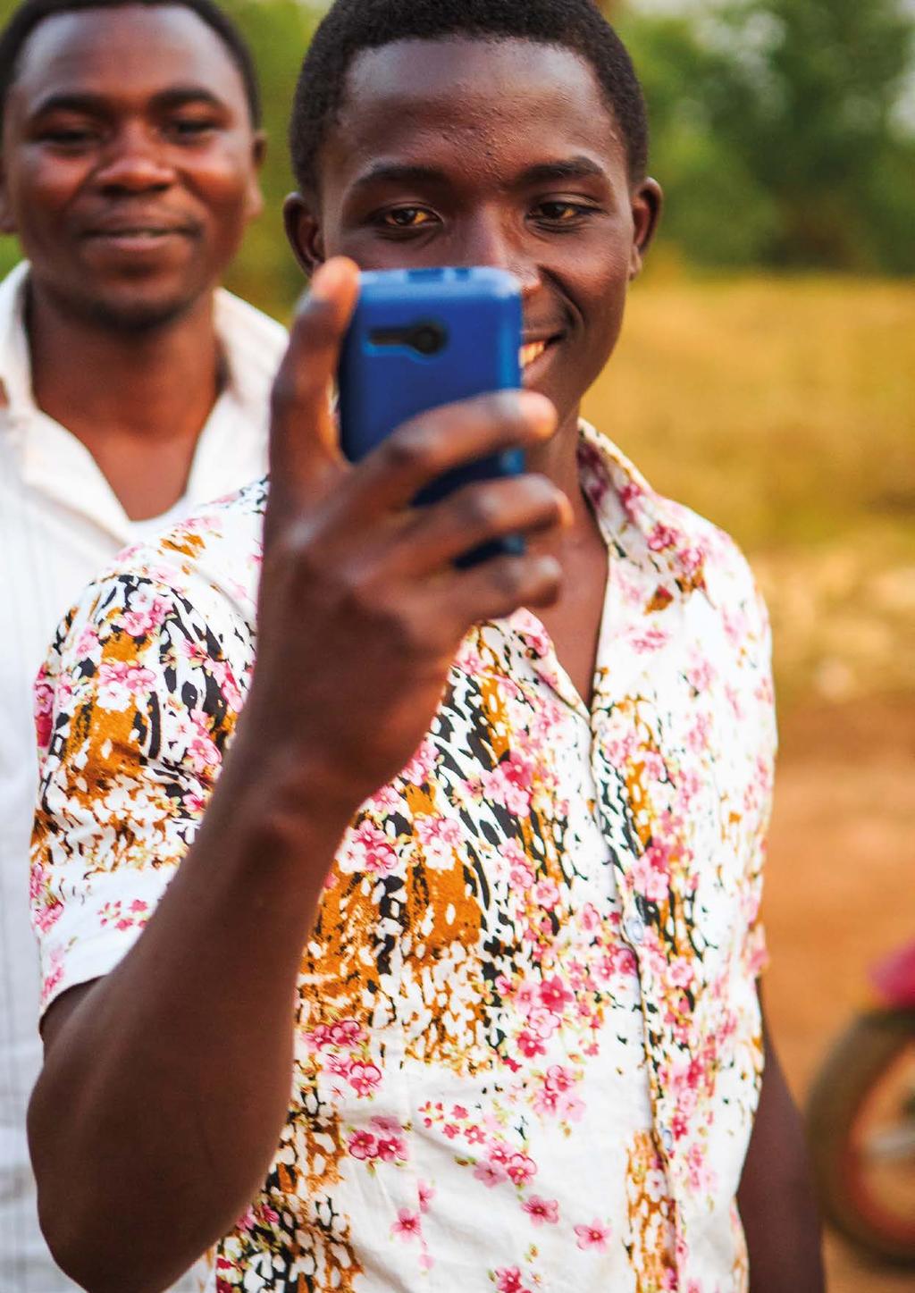 One in five Bibles distributed online A Rwandan teenager with his phone. In 2017, the number of mobile phone users across the world surpassed 4.7 billion.