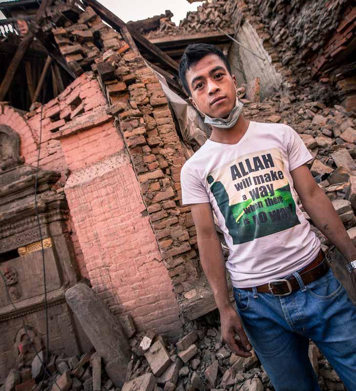NEPAL 23-year-old Omesh worked to clean up the rubble of his home wearing a different shirt one that said in English letters: Allah will make a way when there is no way.