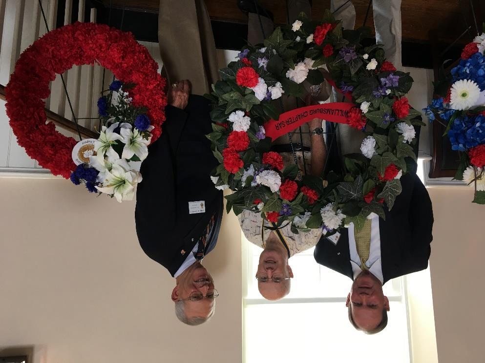 On the right: Williamsburg Chapter Historian, Stephen McGuffin stands with the Williamsburg Chapter wreath which he