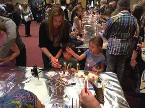 Make your own holiday memories by asking your preschooler to help you light the candles,