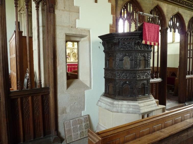 The pulpit is a 2-storey arcaded Jacobean pulpit, 7-sided, cut down, and standing on a 19 th century stone plinth with a flight of 5