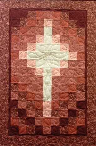 Borders have been added to this banner. For beginner quilters. Finished size 25" x 37". The Cross 2 Small size Banner $9.95 Herald in the Christmas season with this wall hanging.