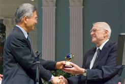 Don Roth, right, receives an award from Adventist Church Secretary G. T.