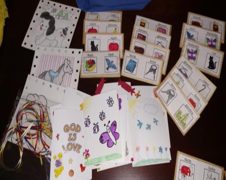 made a set of wooden dominoes with animals and child related pictures in lieu of dots, colored some pictures to