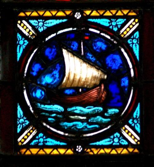 St. Jude St. Jude is depicted by the ship for it reminds us of his missionary journeys. He is said to have traveled a great deal by ship during his missionary journeys.