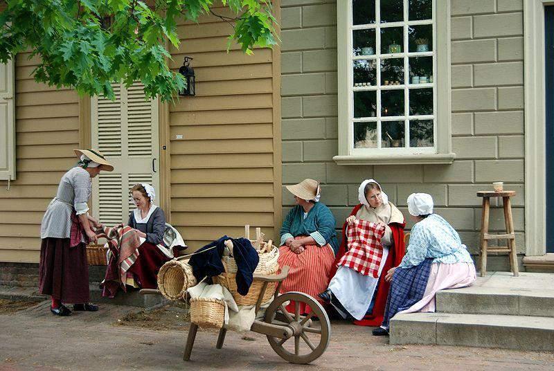 Becoming Americans Basics This image shows ladies in colonial costumes selling