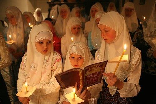 Christian girls worshipping in traditional