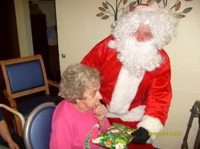 season. Mary Kelley with Santa Claus.
