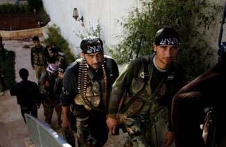 10 Dec. 2, 2012 AP Exclusive: Strife hardens Syrian rebel brigade Syrian fighters of brigade.