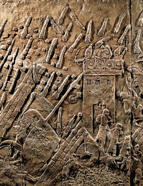 This carving shows an army using a battering ram to break through the walls of a city. The Assyrians were feared for their military might and their cruelty.