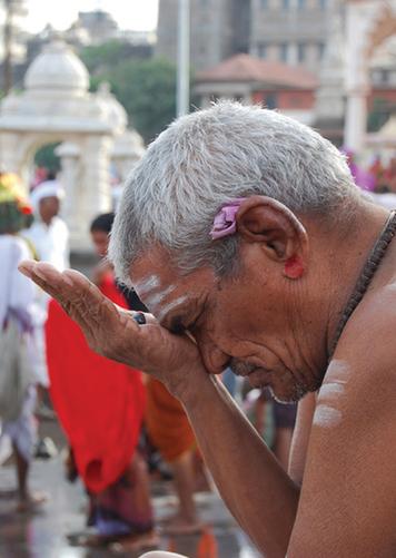 7. Hindu Beliefs About Karma This Hindu man sits in prayer, or meditation.