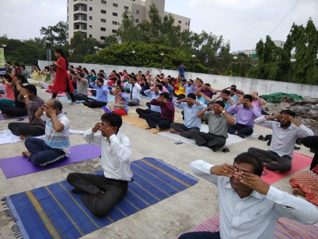 Employees of ICICI bank performing Yoga On the