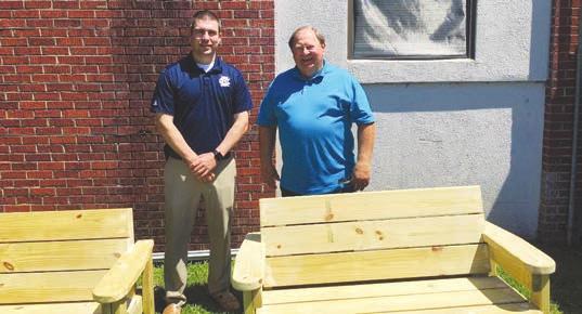 Clarendon County Councilman Benton Blakely, right, dropped off a pair of Buddy Benches that he, his grandsons, Evan and Colin Myers, and his son-inlaw, Nick Myers, built recently.