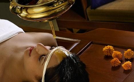 Winding down: Treatments include oil head massage Back in London in our normal lives I can be stressed out throughout the day.